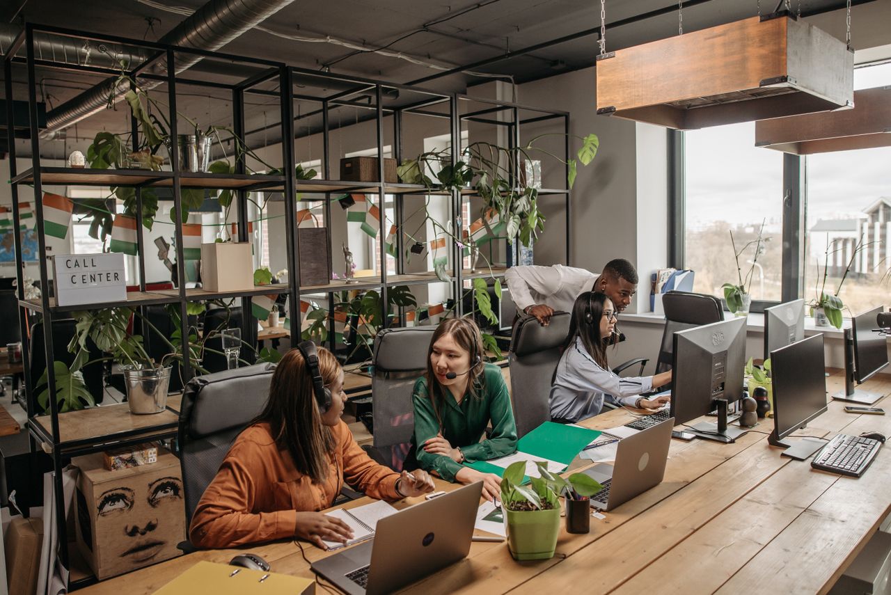 About Group of diverse call center professionals working and collaborating in a modern office setting.